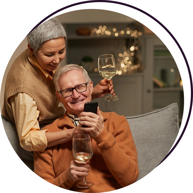 A woman and an older man are drinking wine.